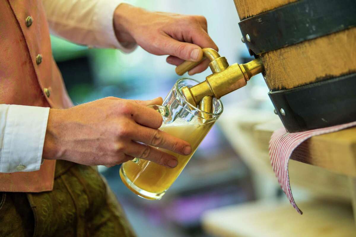 Oktoberfest is a centuries-old tradition in Munich. Beer, such as this one being poured at an event in Munich on July 25, 2018, is an important part of the menu. Beer, along with traditional fare, will be available to partygoers at the Bruce Museum’s first Oktoberfest Sept. 27 in Greenwich.