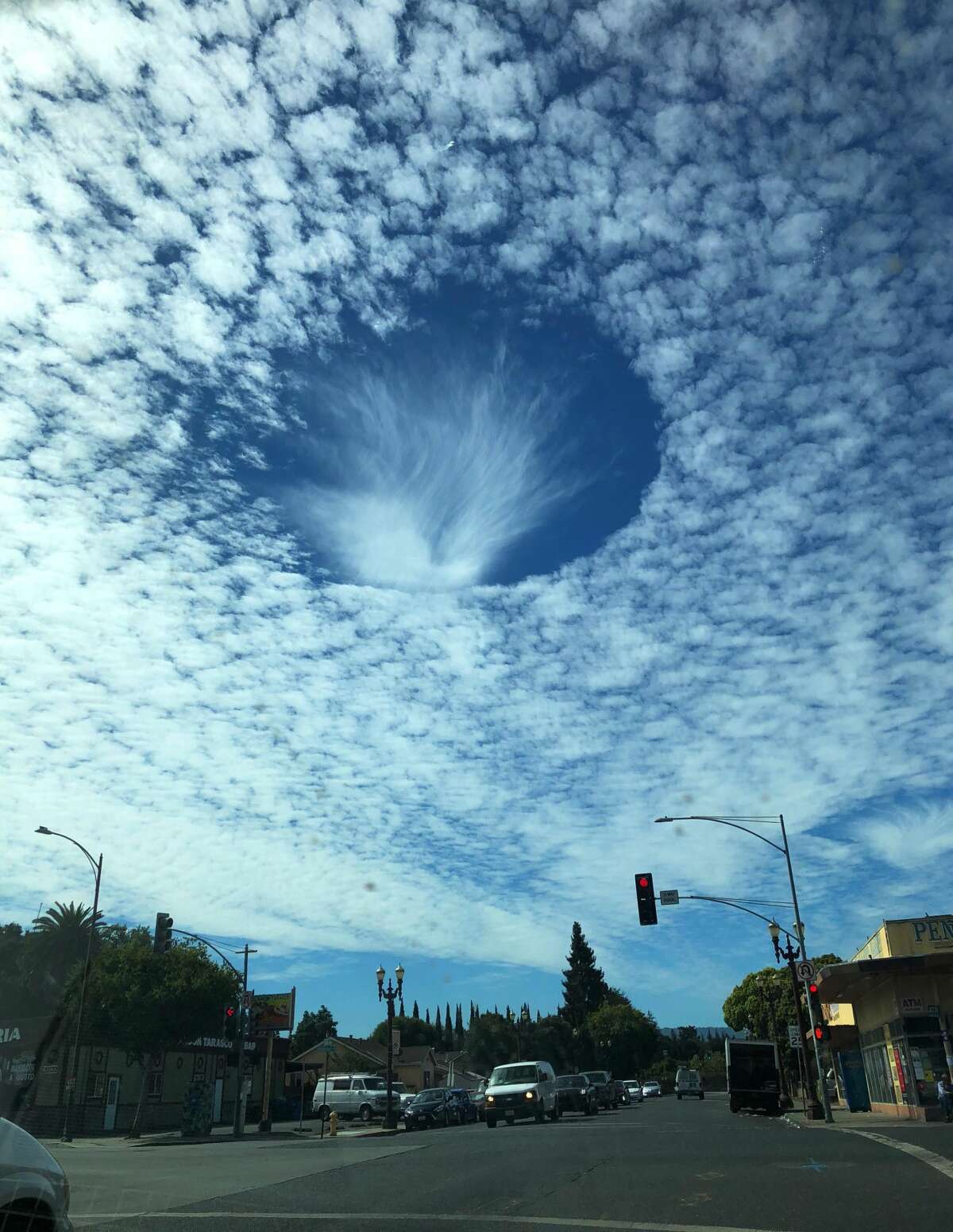 Amazing 'hole punch' phenomenon spotted in clouds over Bay Area
