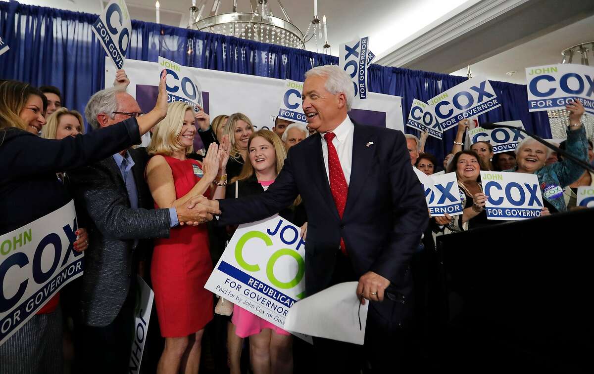 With his wife, Sarah, and daughter Julianne, 13, clapping, California Republican gubernatorial candidate John Cox is greeted at the podium by supporters before speaking at his California Primary election night party at the U.S. Grant Hotel in San Diego, Calif., on Tuesday, June 5, 2018. (Allen J. Schaben/Los Angeles Times/TNS)