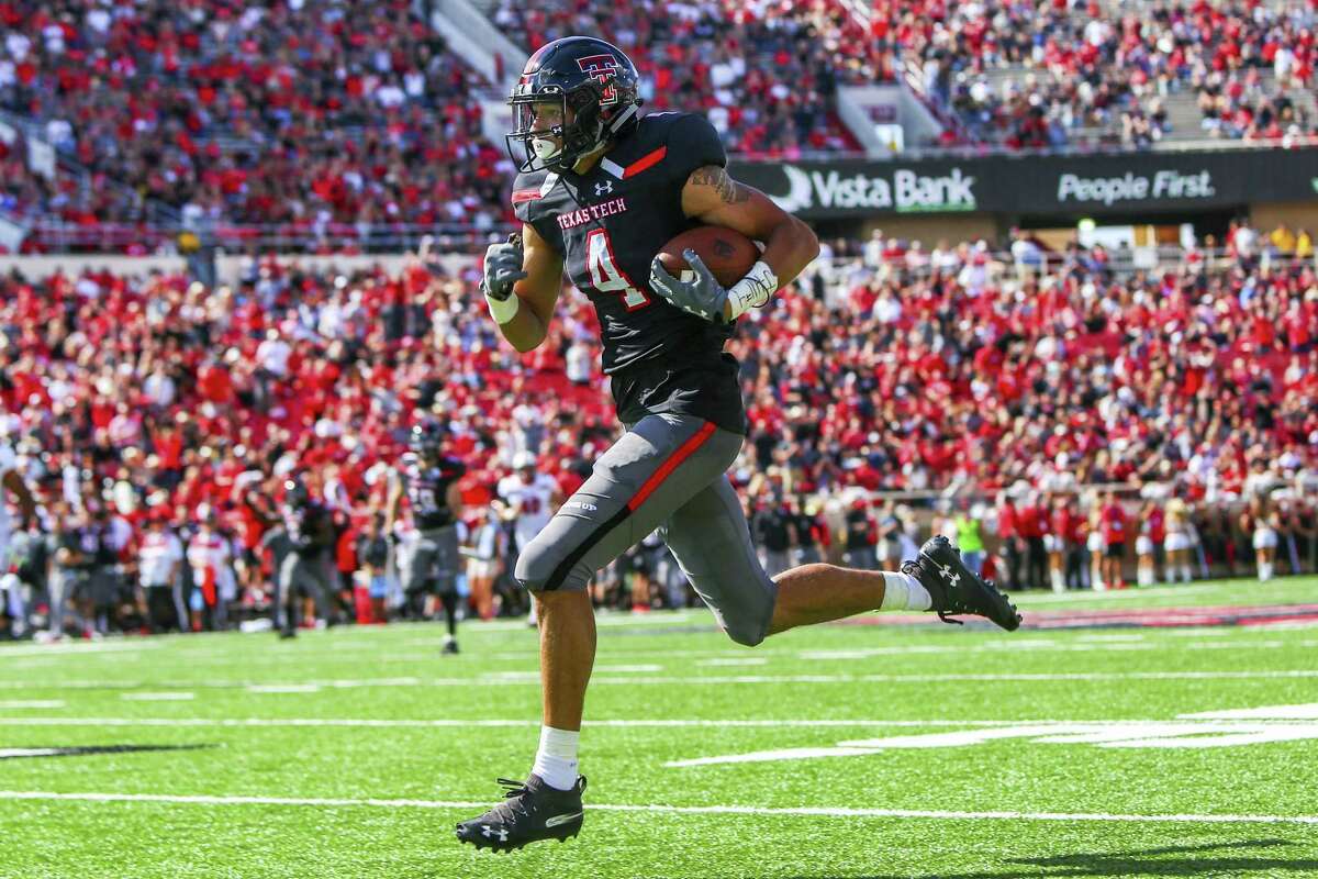 Texas Tech's Antoine Wesley (4) runs for a touchdown during an NCAA college football game against Lamar, Saturday, Sept. 8, 2018, in Lubbock, Texas. (John Moore/Lubbock Avalanche-Journal via AP)