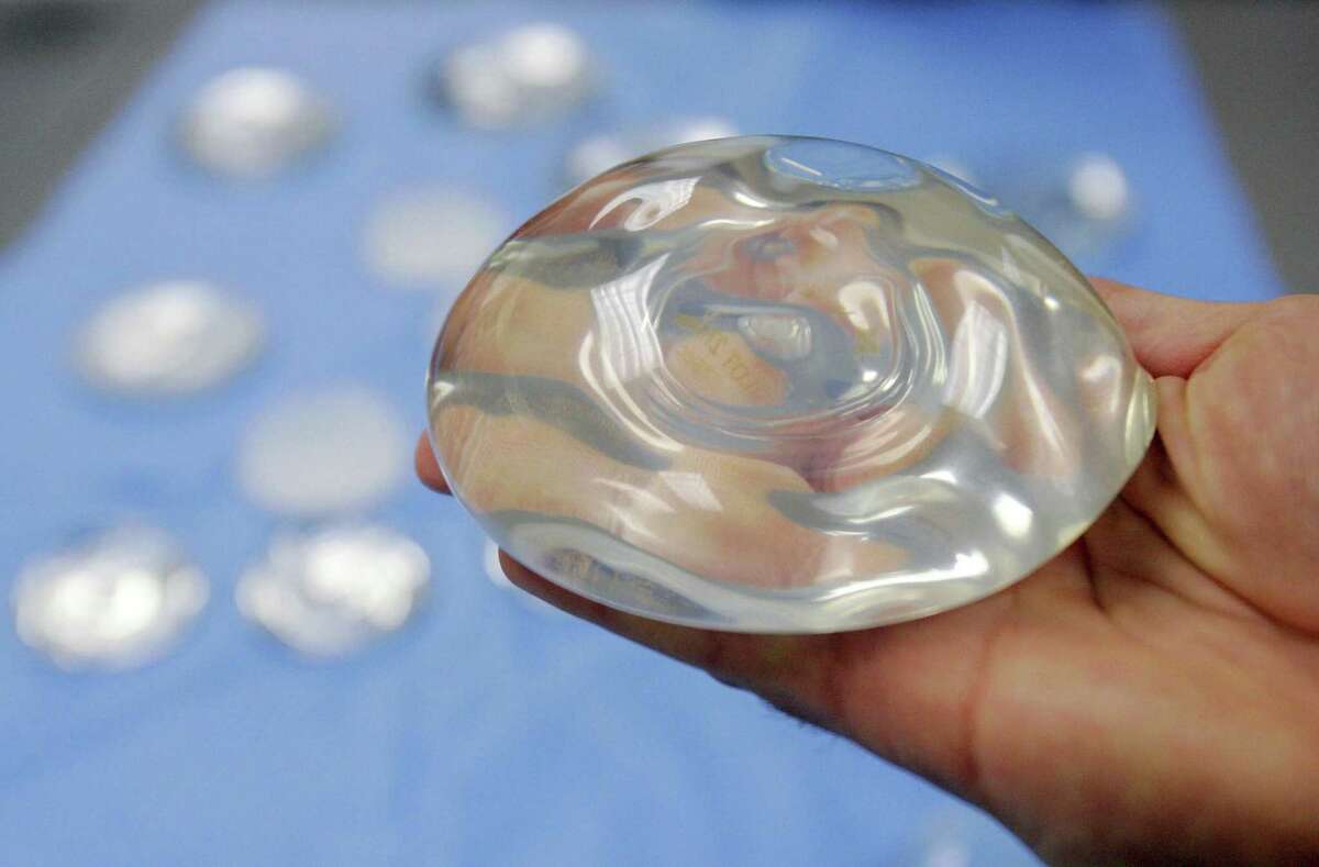 This December 2006 photo shows a silicone gel breast implant at a manufacturing facility in Irving, Texas. On Friday, Sept. 14, 2018, U.S. health officials said they will convene a public meeting of medical advisers in 2019 on the safety of breast implants because of growing science on the topic, including an independent analysis that suggests certain rare health problems might be more common in women with implants containing silicone gel.