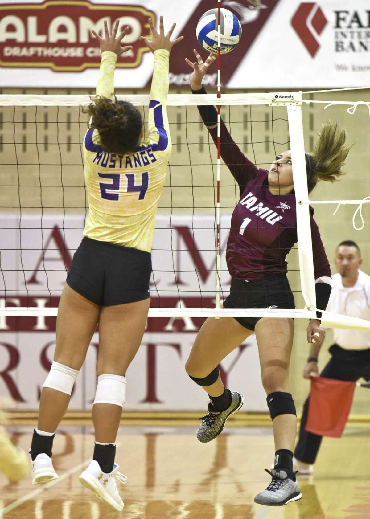 TAMIU Sammantha Herrera taps the ball over the net during a game against The University of Texas of the Permian Basin on Saturday, Sept. 8, 2018, at TAMIU.