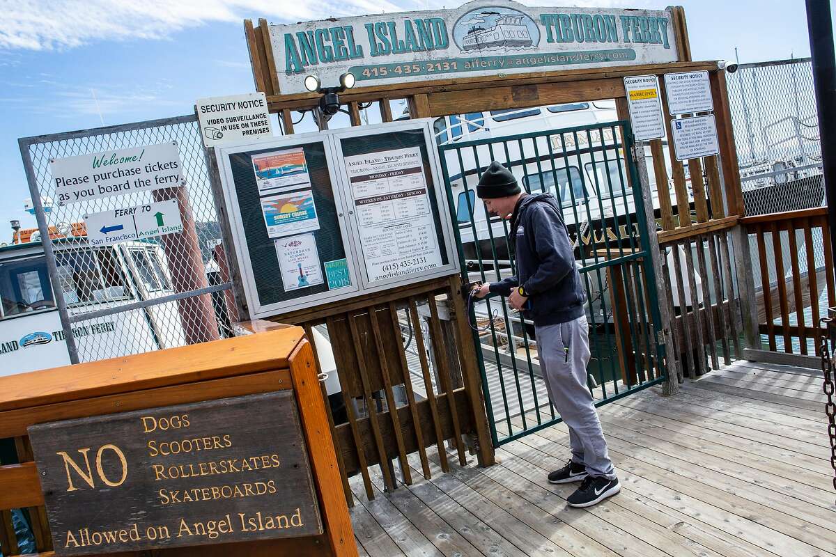 Sam McDonogh opens the gate to the Angel Island - Tiburon Ferry on Friday, Sept. 14, 2018, in Tiburon, Calif. McDonogh is part of the family business Angel Island - Tiburon Ferry.