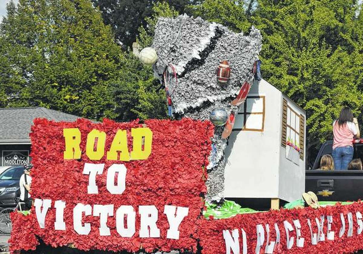 A float designed with a Wizard of Oz theme rolls down the street Friday at the Jacksonville homecoming parade.