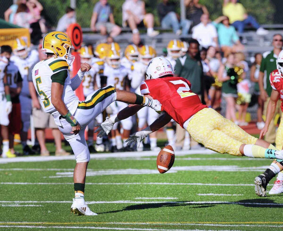 Greenwich’s Evan Weigold blocks the punt of Trinity kicker Sam Pensiero during the second quarter on Saturday.