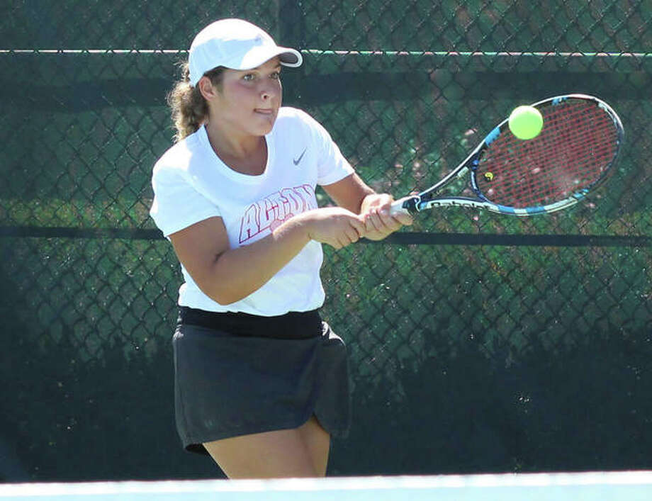 Alton’s Hannah Macias returns a shot during her No. 1 singles semifinal on Saturday at Alton’s Robert Logan Invitational girls tennis tournament at LCCC’s Andy Simpson Tennis Complex in Godfrey. Macias placed second in her flight. Photo: Greg Shashack / The Telegraph