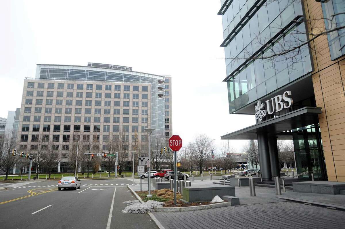 UBS’ Stamford offices were formerly located at 677 Washington Blvd., at left before moving its downsized Stamford contingent in 2016 across the street to 600 Washington Blvd., at right. Space at 600 Washington became available in the wake of hundreds of layoffs at Royal Bank of Scotland, which owns 600 Washington.