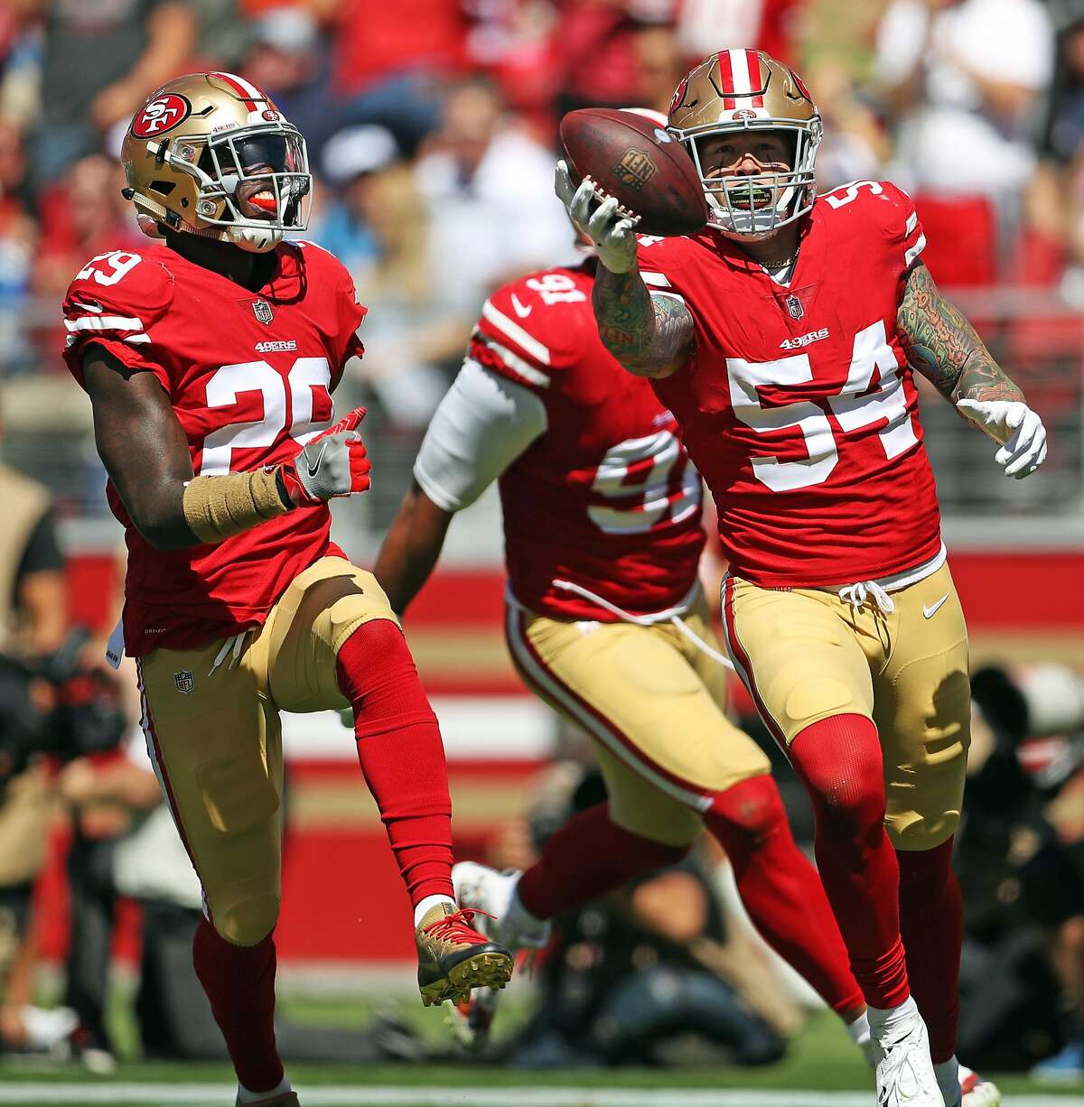 San Francisco 49ers' Cassius Marsh celebrates after causing