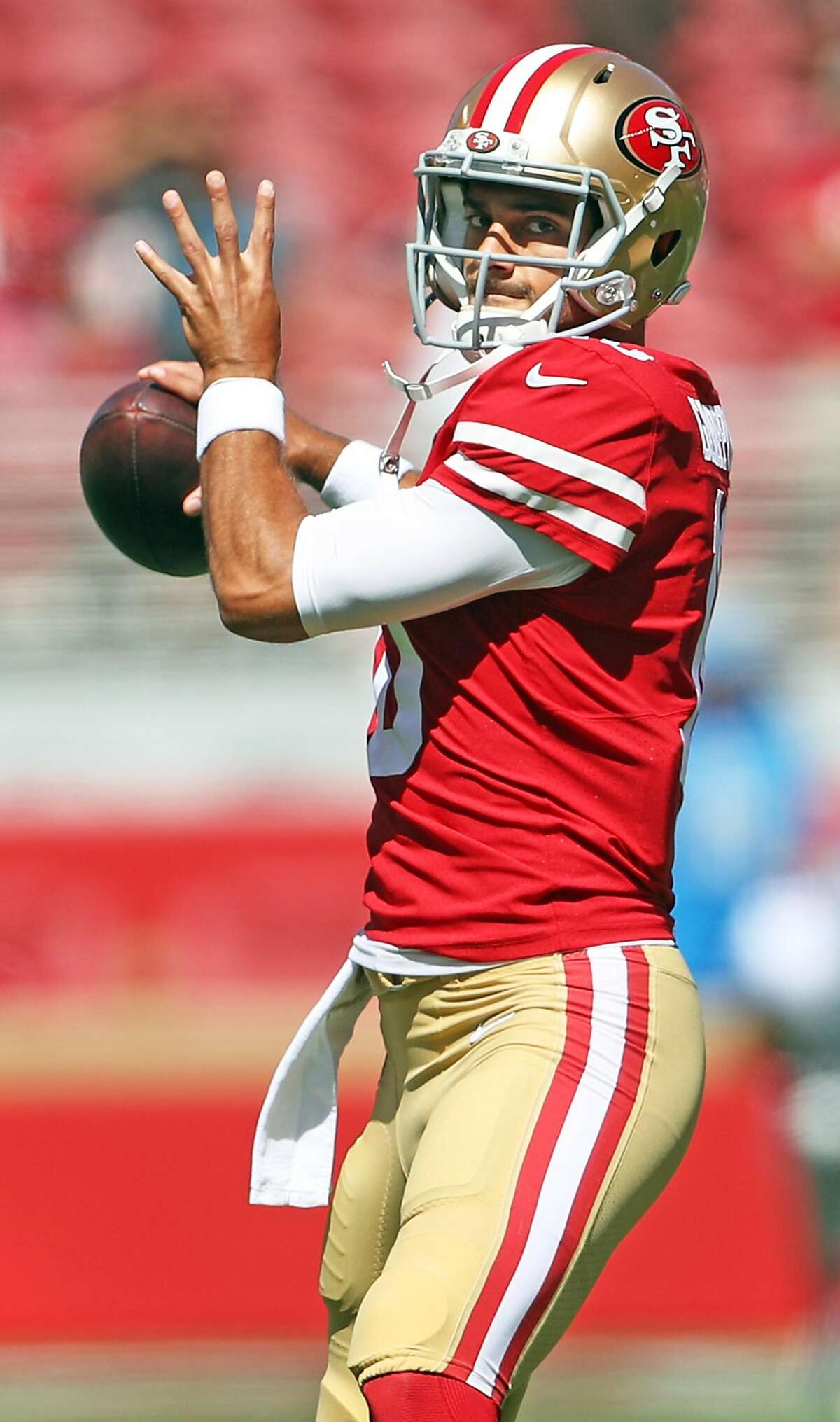 San Francisco 49ers' Jimmy Garoppolo warms up before playing Detroit Lions during NFL game at Levi's Stadium in Santa Clara, Calif. on Sunday, September 16, 2018.