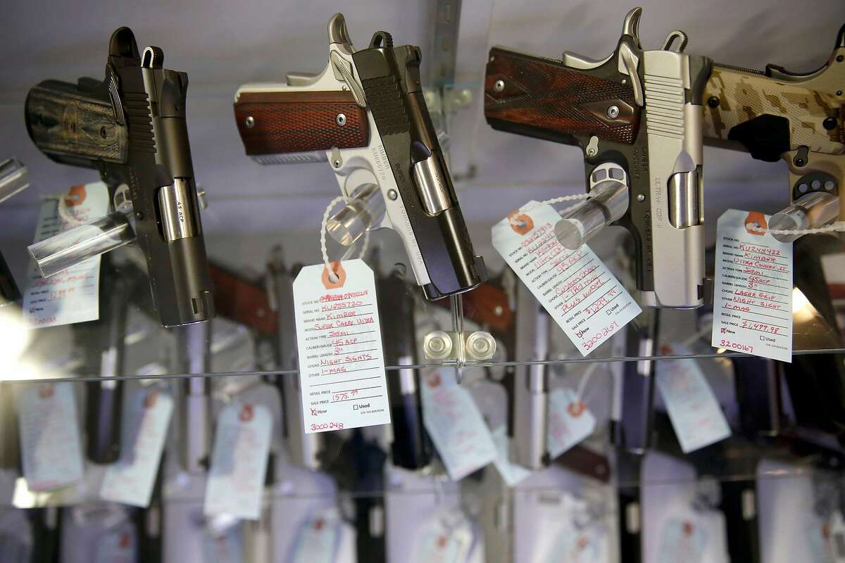 FILE - This Nov. 15, 2014 file photo, shows handguns in a display case at Metro Shooting Supplies, in Bridgeton, Mo. Gun sales have spiked in the region in the past year, and so have applications for concealed-carry permits. Policing experts say that with more guns come more gun thefts. (AP Photo/Jeff Roberson, File)