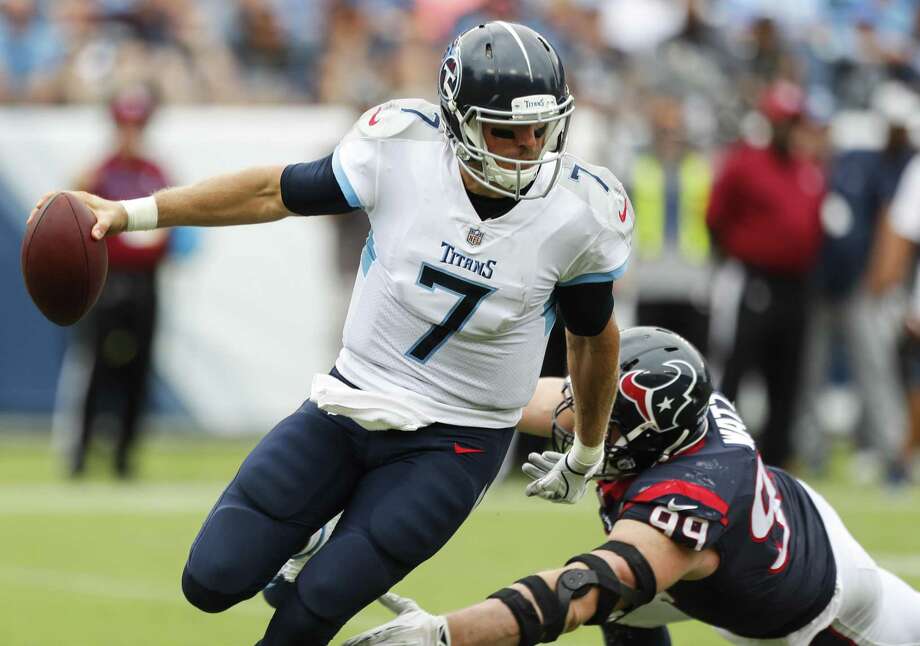 Blaine Gabbert (7), Tennessee Titans quarterback, stands out from Houston Texans defensive end JJ Watt (99) makes first pass in fourth quarter of NFL football game at Nissan Stadium on Sunday, September 16, 2018 in Nashville. Photo: Brett Coomer, Houston Chronicle / Staff Photographer / © 2018 Houston Chronicle