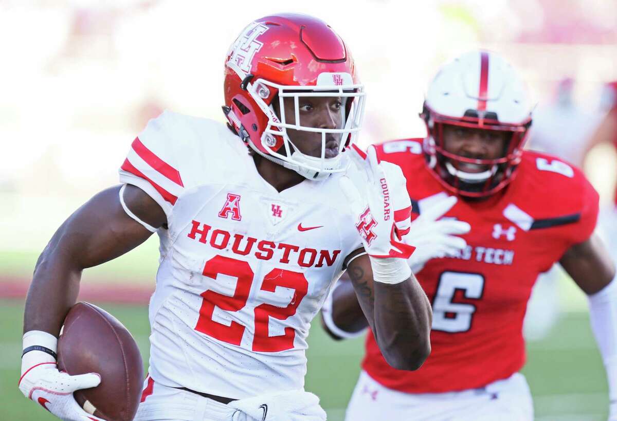 Houston's Terence Williams (22) carries the ball during an NCAA college football game against Texas Tech, Saturday, Sept. 15, 2018, in Lubbock, Texas. (Sam Grenadier/Lubbock Avalanche-Journal via AP)