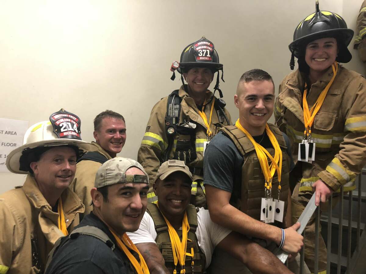 Chief Brian McGary, back row from left, Landry Adkins, Victor Macias and Samantha Medley; and Elijah Quesada, front row from left, Gabriel Dominguez and Cameron Tarango during a stair climb when it was held downtown