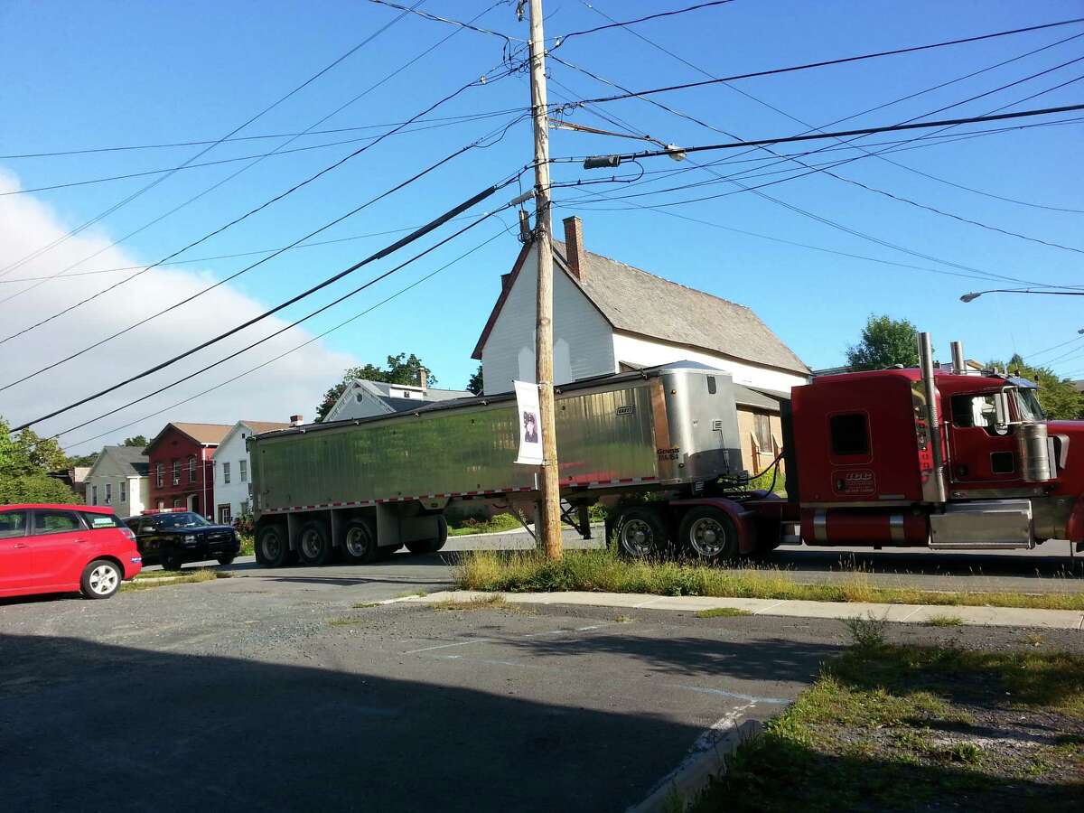 A tractor trailer is stopped and weighed by State Police on Partition Street last week on its way to the Dunn construction and demolition debris landfill in Rensselaer. Several trucks were ticketed for being heavier than allowed under state transportation law.