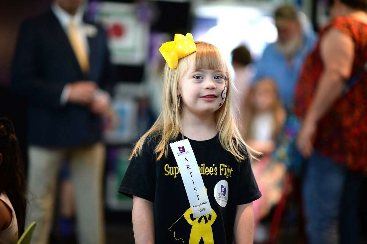 On Saturday, Sept. 8, the Periwinkle Foundation unveiled the 28th Making A Mark art exhibit consisting of art and creative writing by children touched by cancer and blood disorders at Texas Children?’s Cancer and Hematology Centers. Shown here is Bailee Malgren, 5.