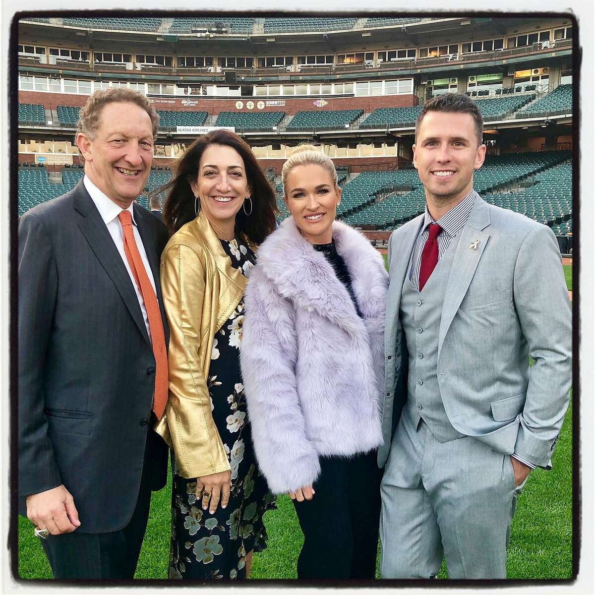 Giants CEO Larry Baer (left) with his wife, Pam Baer and Kristen and Buster Posey at the BP28 Gala. Sept. 13, 2018.