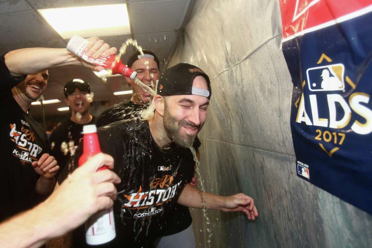 Mike Fiers #54 of the Houston Astros celebrates with teammates in the clubhouse after defeating the Boston Red Sox 5-4 in game four of the American League Division Series at Fenway Park on October 9, 2017 in Boston, Massachusetts. The Astros advance to the American League Championship Series.