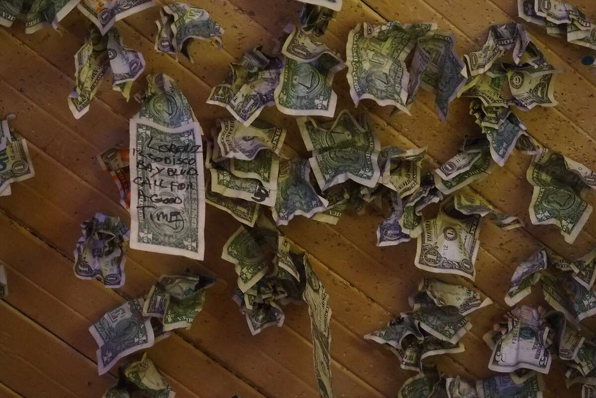 Dollar bills stuck to the ceiling at Al's Place (also known as Al the Wop's) in the historical Chinese town of Locke.