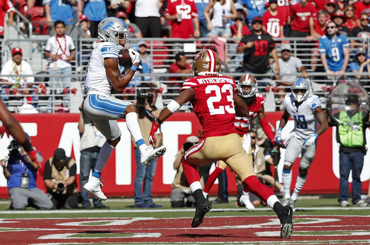 Detroit Lions wide receiver Marvin Jones Jr. catches the ball for a touchdown as San Francisco 49ers cornerback Ahkello Witherspoon looks on during the second half of an NFL football game in Santa Clara, Calif., Sunday, Sept. 16, 2018. (AP Photo/Tony Avelar)