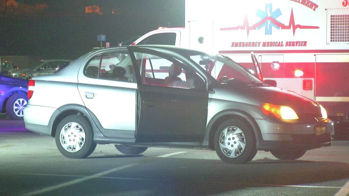 A woman was rushed to University Hospital after a car came to a stop on top of her Monday, Sept. 17, 2018, in a parking lot of a San Antonio Walmart.