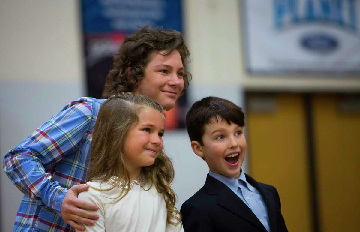 Stars of the TV show "Young Sheldon" pose for a picture at Klein Oak High School on Monday, Sept. 17, 2018.