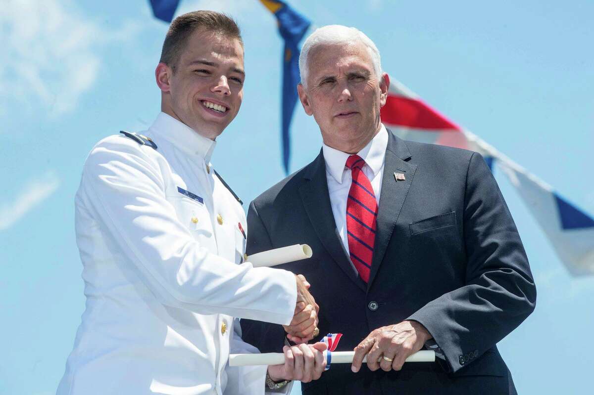 Coast Guard Douglas R. Brown, son of Brad and Sally Brown of Clifton, Park, receives a bachelor of science with high honors from Vice President Mike Pence upon graduation and commissioning as an ensign at the Coast Guard Academy in New London, Conn.