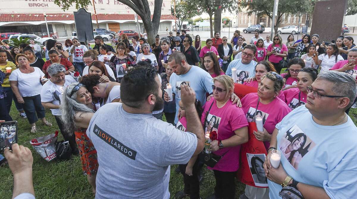 Family and friends of the four alleged victims of Juan David Ortiz gather at San Agustin plaza for a candlelight vigil on Tuesday, Sept. 18, 2018.