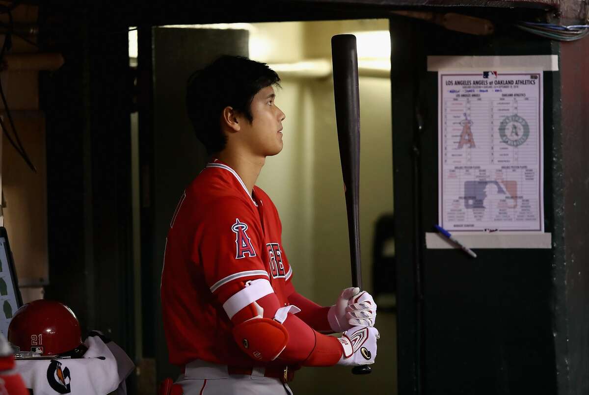 OAKLAND, CA - SEPTEMBER 18: Shohei Ohtani #17 of the Los Angeles Angels stands in the dugout during their game against the Oakland Athletics at Oakland Alameda Coliseum on September 18, 2018 in Oakland, California. (Photo by Ezra Shaw/Getty Images)