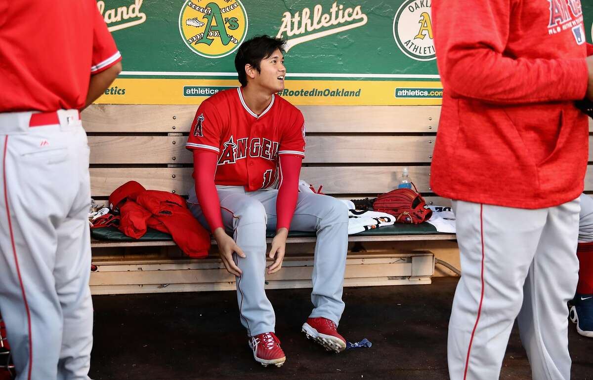 OAKLAND, CA - SEPTEMBER 18: Shohei Ohtani #17 of the Los Angeles Angels sits in the dugout before their game against the Oakland Athletics at Oakland Alameda Coliseum on September 18, 2018 in Oakland, California. (Photo by Ezra Shaw/Getty Images)