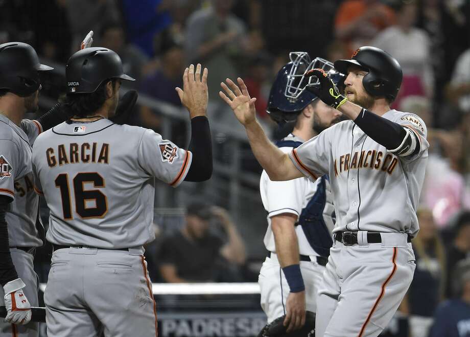 by aramis garcia #16 and chris shaw #26 after hitting a two-run