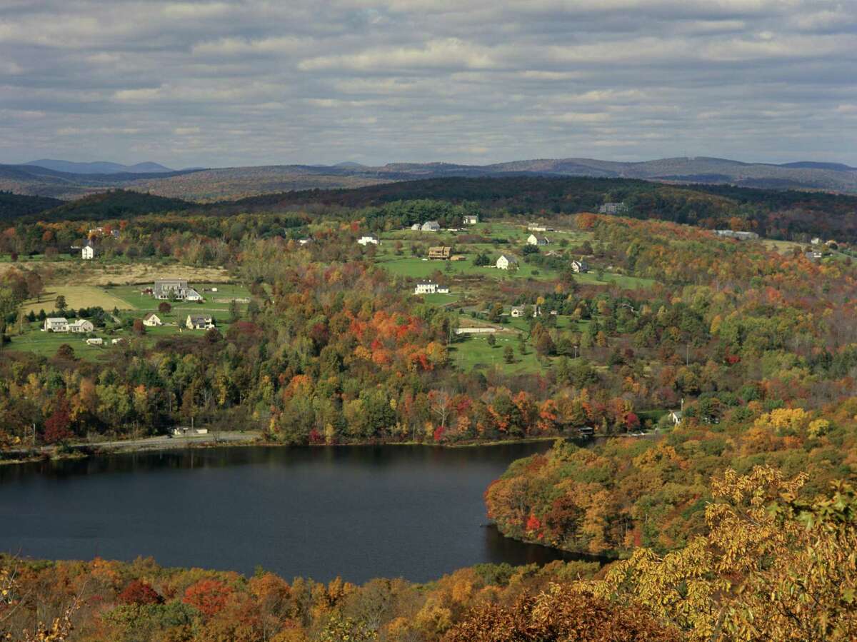 Autumn color alights the Litchfield Hills. Below, cruising the Connecticut River.