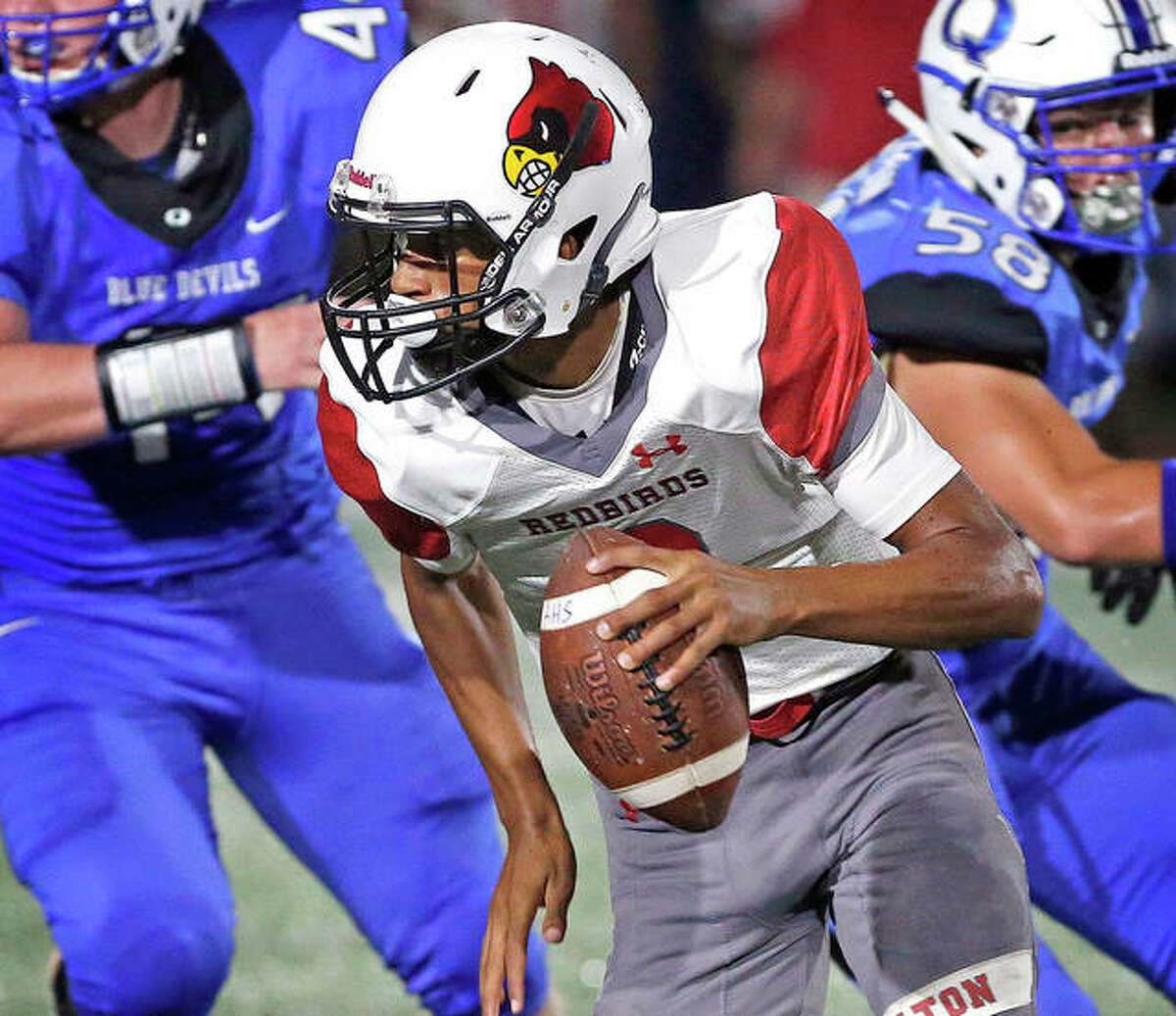 Alton quarterback Andrew Jones threw a pair of touchdown passes in the Redbirds’ loss to Belleville West Friday. Alton will play at Edwardsville this Friday at 7 p.m. at the District 7 Sports Complex. Jones is shown in action earlier this season against Quincy.