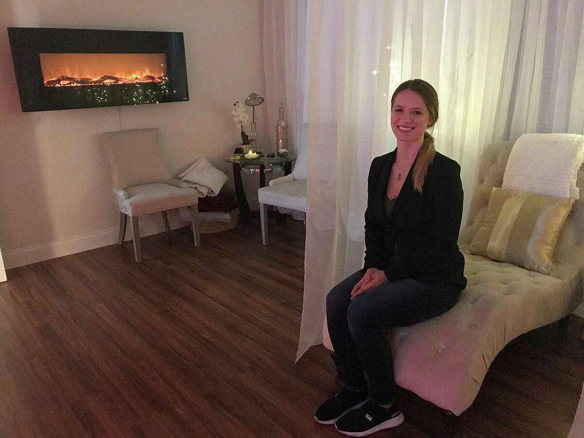 Lisa Sentementes, manager of Therapeutic Massage and Wellness in Danbury, sits in the spa's renovated luxury room on Tuesday, Sept. 18, 2018.