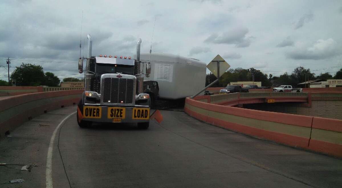 LPD Zapata Highway reopens after tractortrailer hangs from ledge