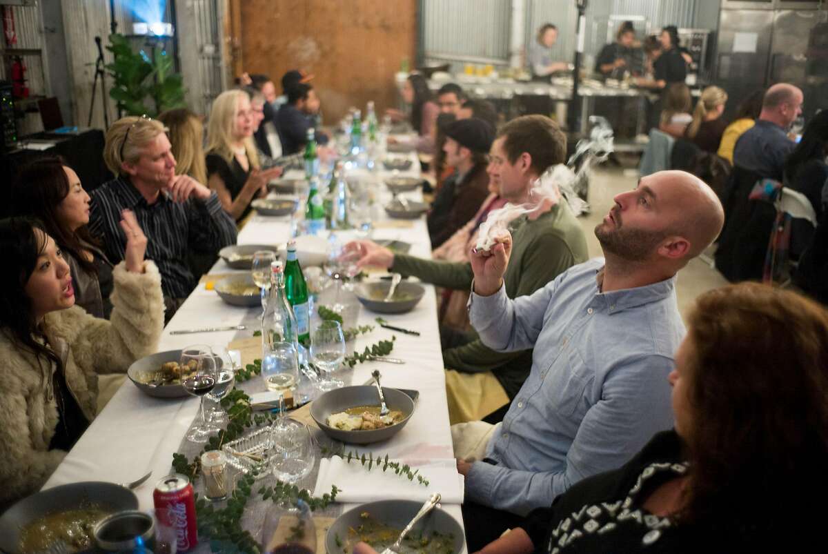 Michael Ray smokes a joint during a Cannaisseur dinner in San Francisco, Calif. on Saturday, Sept. 16, 2018. Cannaisseurs blends cannabis and fine dining for a unique experience.