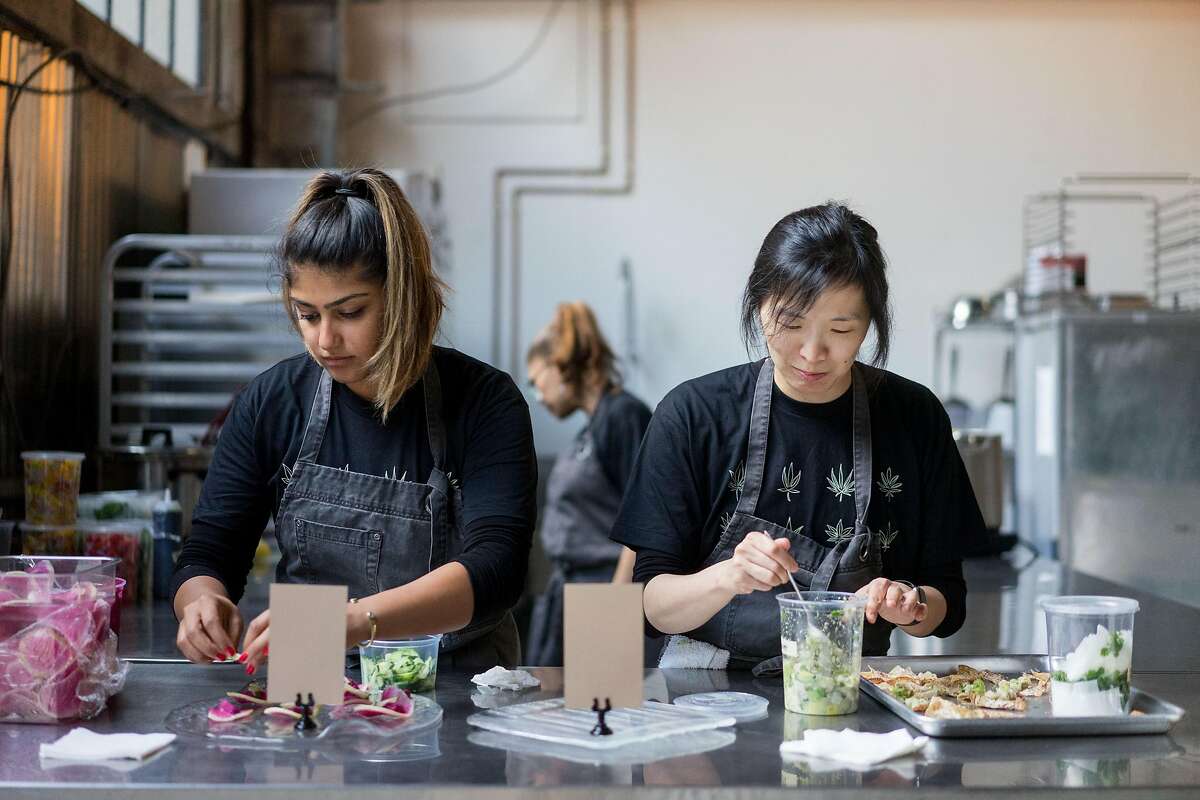 Ajinder Plahey, left, and Mandy Morris plate appetizers during a Cannaisseur dinner in San Francisco, Calif. on Saturday, Sept. 16, 2018. Cannaisseurs blends cannabis and fine dining for a unique experience.