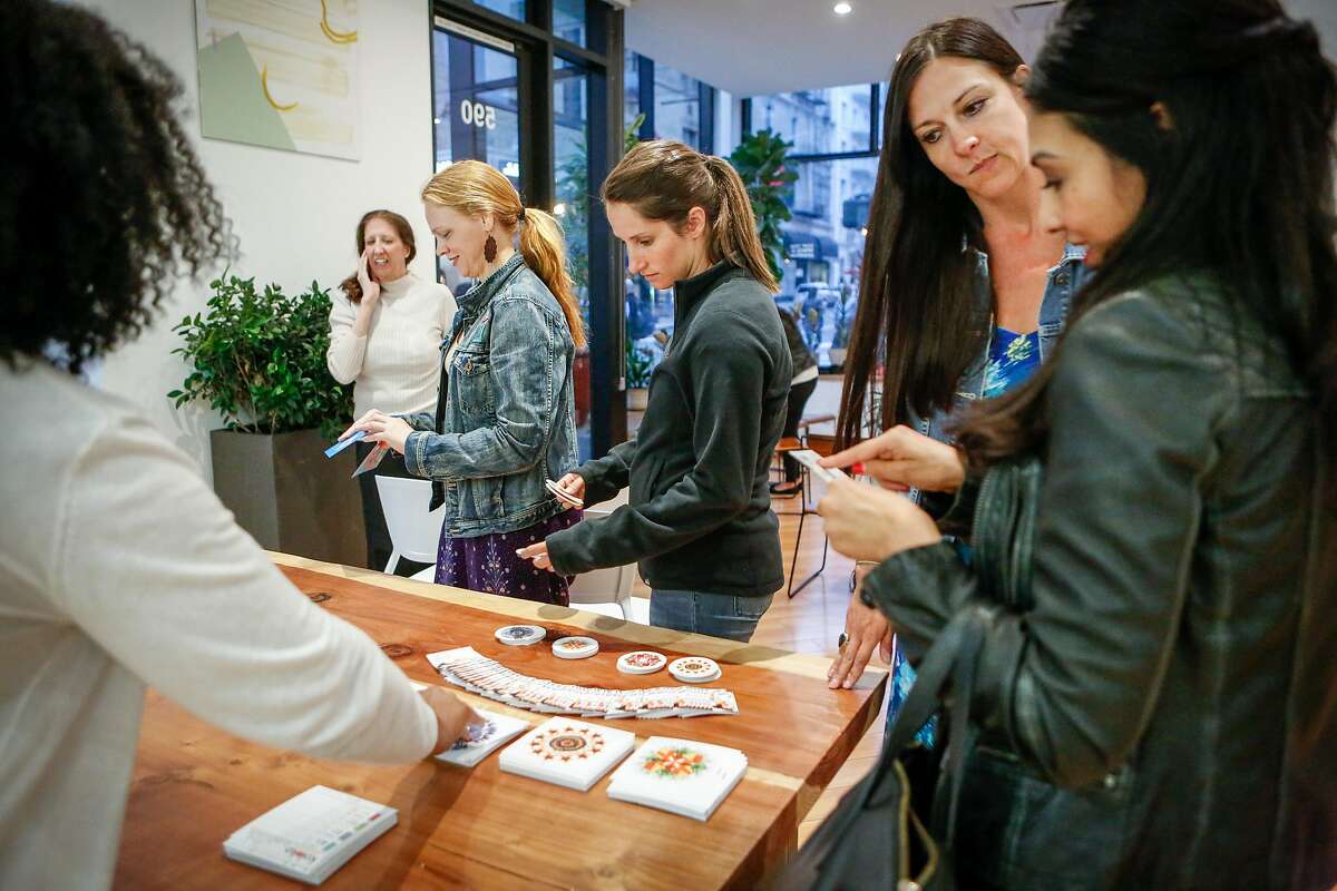 Participants discuss cannabis-infused herbal tea on Wednesday, July 25, 2018 in San Francisco, California. Ellementa organizes gatherings for women to share stories and experiences with cannabis and CBD and learn from experts in the field and discover new products.