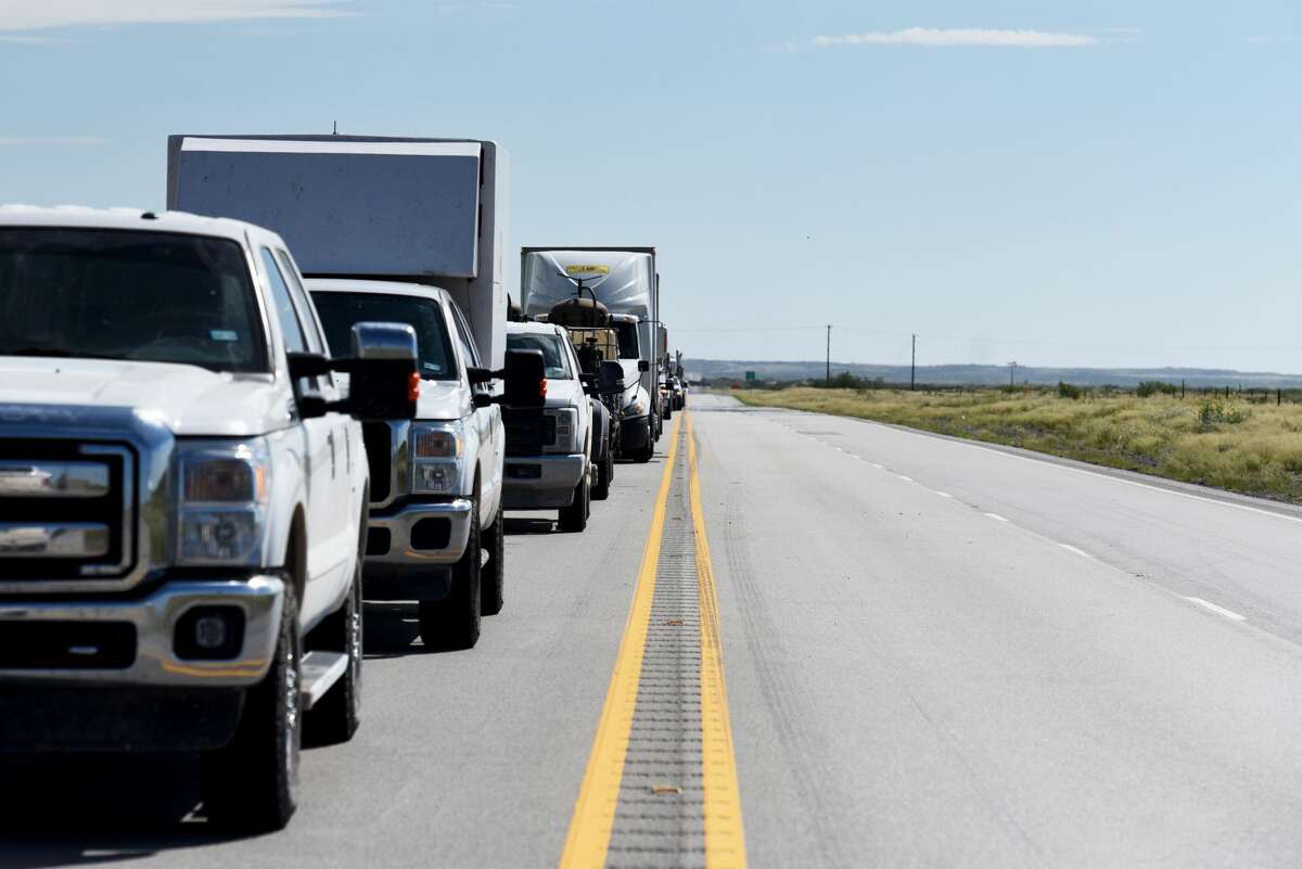 Vehicles sit in traffic on Highway 302 near Kermit, Texas, U.S., on Friday, Aug. 24, 2018. Communities across the country are seeking funding for infrastructure needs. The good news for communities in the Permian Basin, and rural communities in general, is that funds may be easier to come by under the Trump administration.