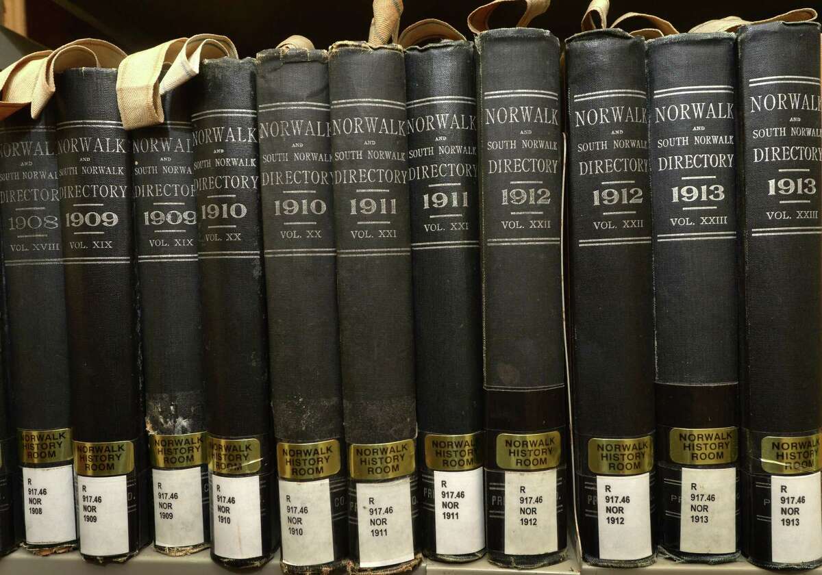 Volumes of the Norwalk Directory dating back to the early nineteenth century in the basement level Norwalk History Room of the Norwalk Library Tuesday, September 18, 2018, in Norwalk, Conn. This Sunday, Norwalk Library will celebrate the 5th anniversary of its History Room with a reception featuring High Tea, a photo exhibit of Norwalk History, the newly digitized Norwalk Hour, and talks from Norwalk history authors and citizen researchers.