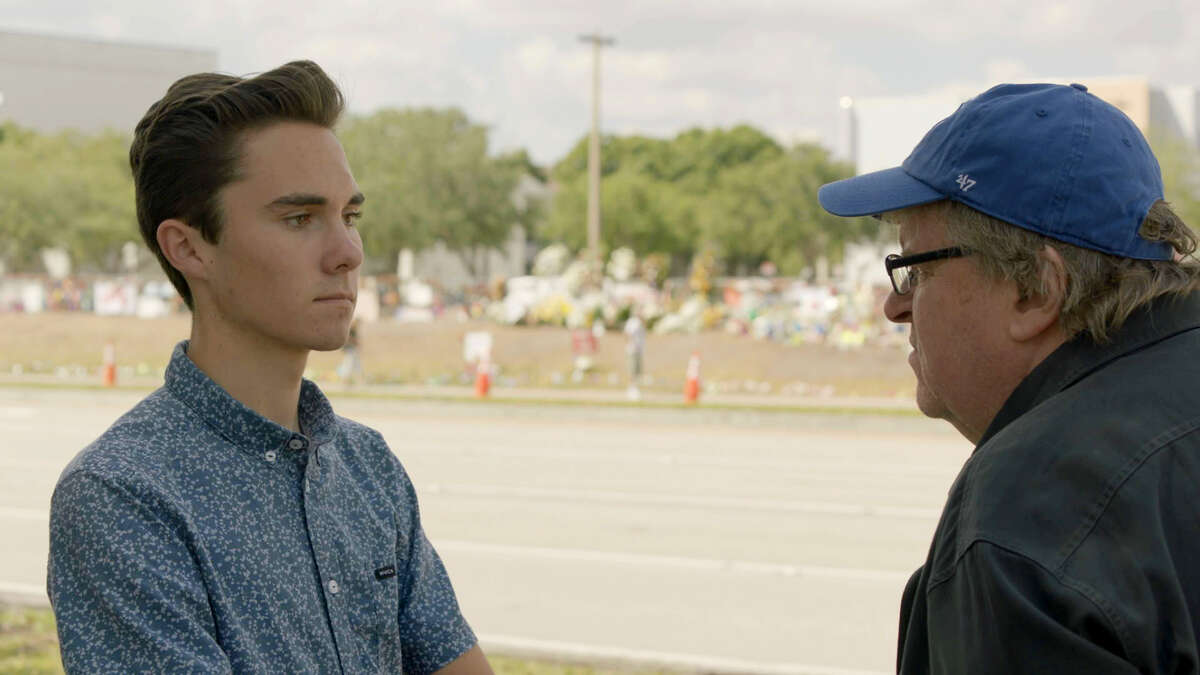 Filmmaker Michael Moore, right, interviews David Hogg, a survivor of the Parkland school shooting and a gun-control activist.