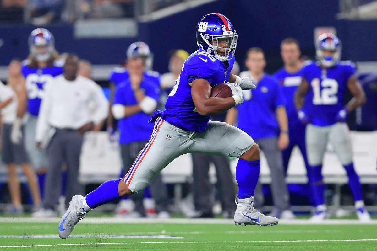 ARLINGTON, TX - SEPTEMBER 16: Saquon Barkley #26 of the New York Giants carries the ball against the Dallas Cowboys in the fourth quarter at AT&T Stadium on September 16, 2018 in Arlington, Texas.