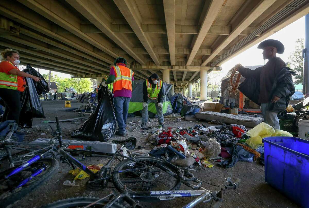 Clean up crews with the city conduct a deep cleanup of the Wheeler Homeless Encampment located under the US 59 Freeway in Houston.