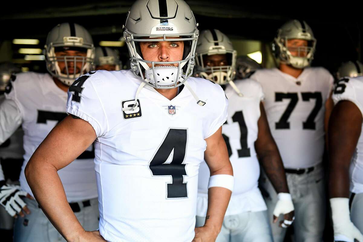 DENVER, CO - SEPTEMBER 16: Derek Carr (4) of the Oakland Raiders prepares to lead his team onto the field against the Denver Broncos before the first quarter on Sunday, September 16, 2017. The Denver Broncos hosted the Oakland Raiders. (Photo by AAron Ontiveroz/The Denver Post via Getty Images)