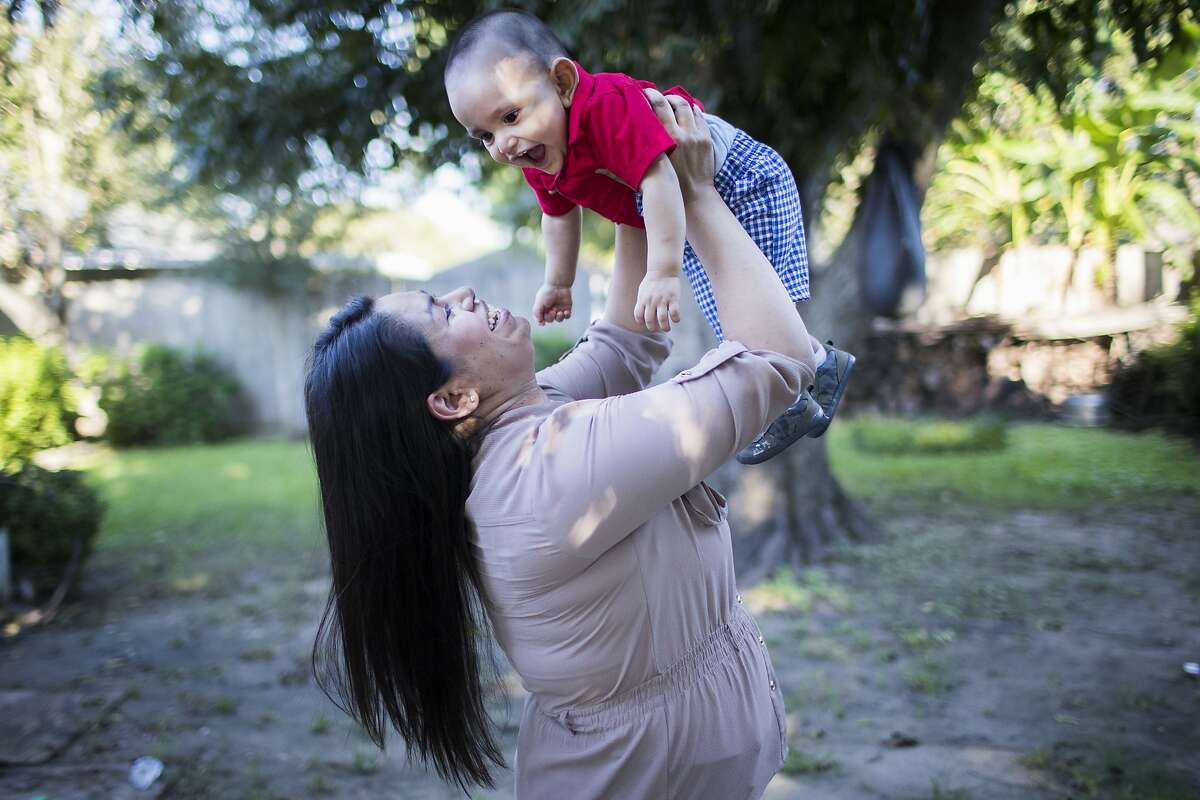 Maria Guadalupe Juarez, 28, plays with her son Isaac Juarez, 10-months-old, Wednesday, Sept. 19, 2018, in Pearland. Juarez has been in Houston for the past eleven years and since 2015 she has been a Deferred Action for Childhood Arrivals (DACA) recipient.
