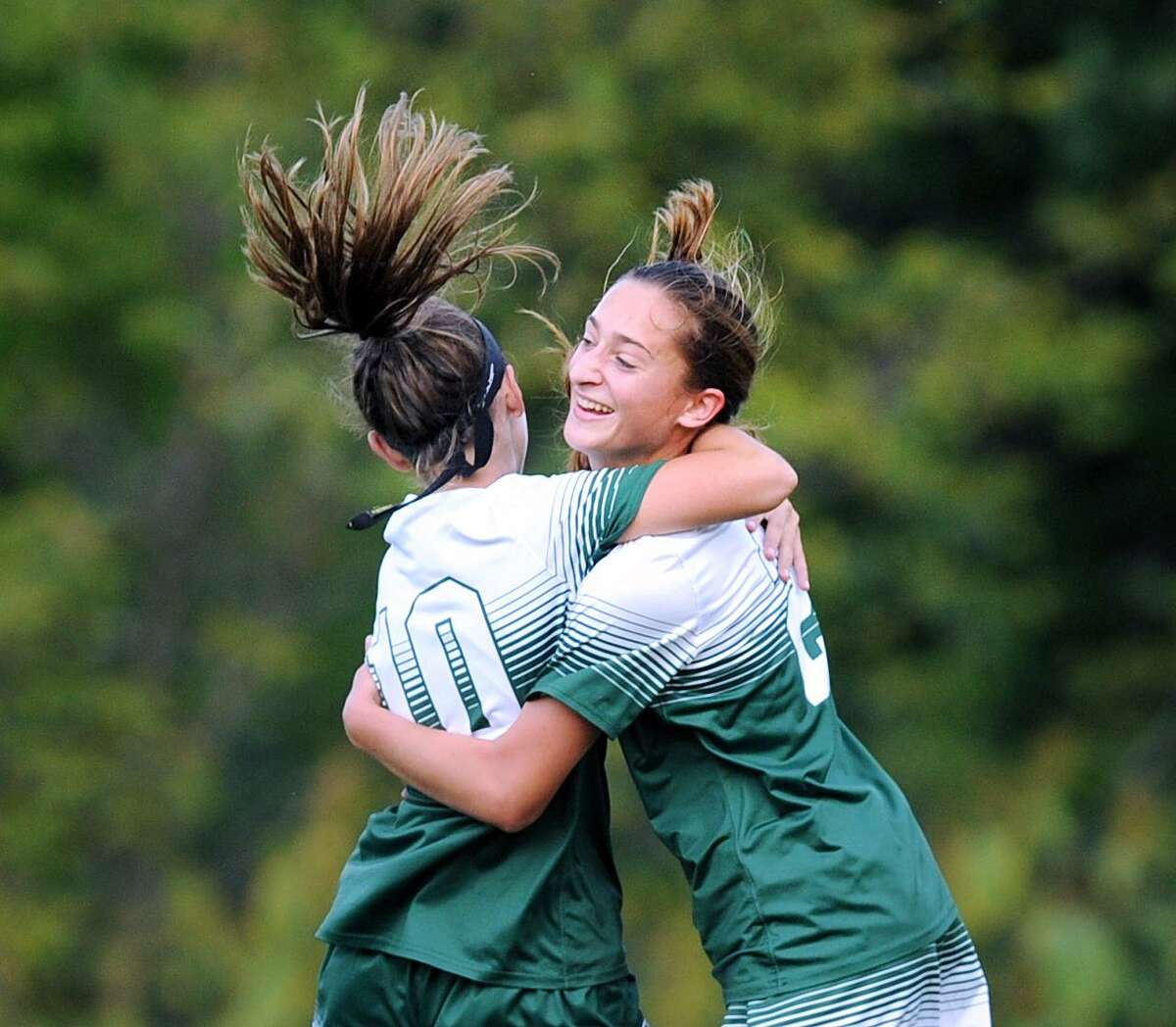 Isabel DeVita, left, of Sacred Heart Greenwich congratulates teammate Alana Frederick on scoring a first-half goal against Choate Rosemary Hall Wednesday in Greenwich.