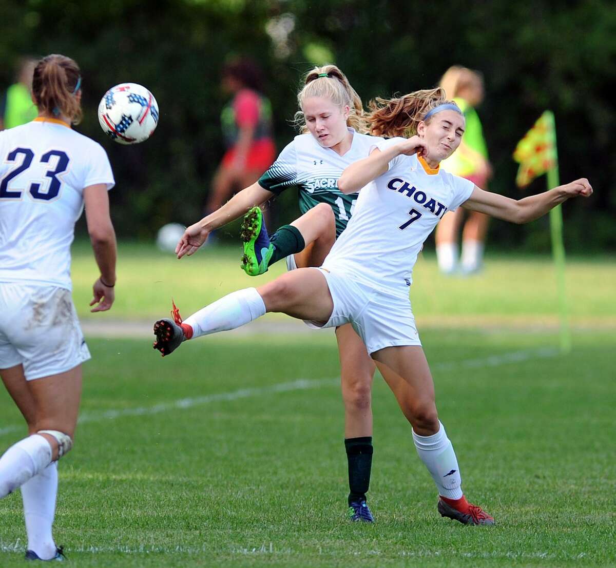 At right, Choate's Julianne Sekula (#7) and Sacred Heart's Hannah Dempsey (#15) vie for a ball in the air during the girls high school soccer match between Sacred Heart Greenwich and Choate Rosemary Hall at Greenwich, Conn., Wednesday, Sept. 19th, 2018.