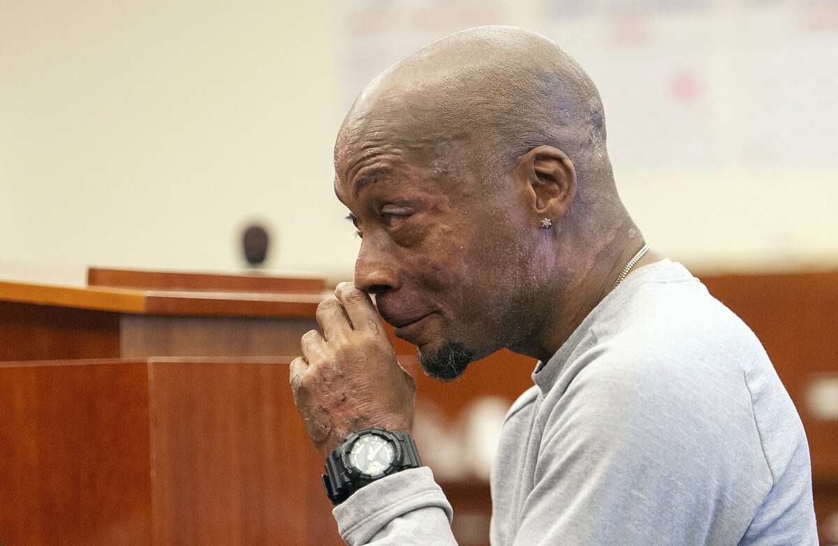 FILE - In this Aug. 10, 2018, file photo, plaintiff DeWayne Johnson reacts after hearing the verdict in his case against Monsanto at the Superior Court in San Francisco. A jury on Friday, Aug, 10, ordered agribusiness giant Monsanto to pay $289 million to the former school groundskeeper dying of cancer, saying the company's popular Roundup weed killer contributed to his disease. Agribusiness giant Monsanto is asking a San Francisco judge to throw out the award to Johnson. Attorneys for Monsanto said in court documents filed late Tuesday, Sept. 18, 2018, that Johnson failed to prove that Roundup or similar herbicides caused his non-Hodgkin's lymphoma. (Josh Edelson/Pool Photo via AP, File)