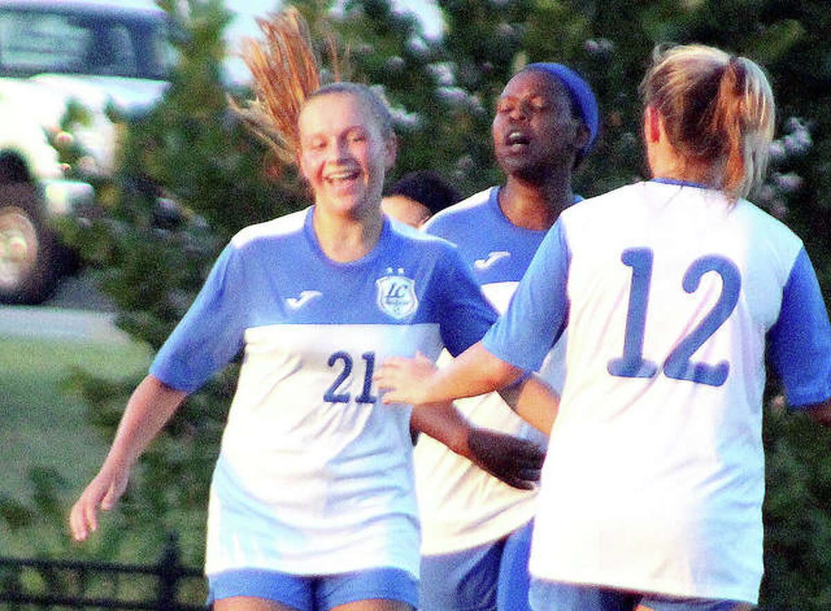 LCCC’s Emma Lucas (21) is congratulated by teammates Boitumelo Rabale, center and Kassidy Louvall after scoring the game-wining goal for the Trailblazers in Wednesday’s 3-1 home victory over St. Louis Community College. Lucas is a freshman from Roxana.