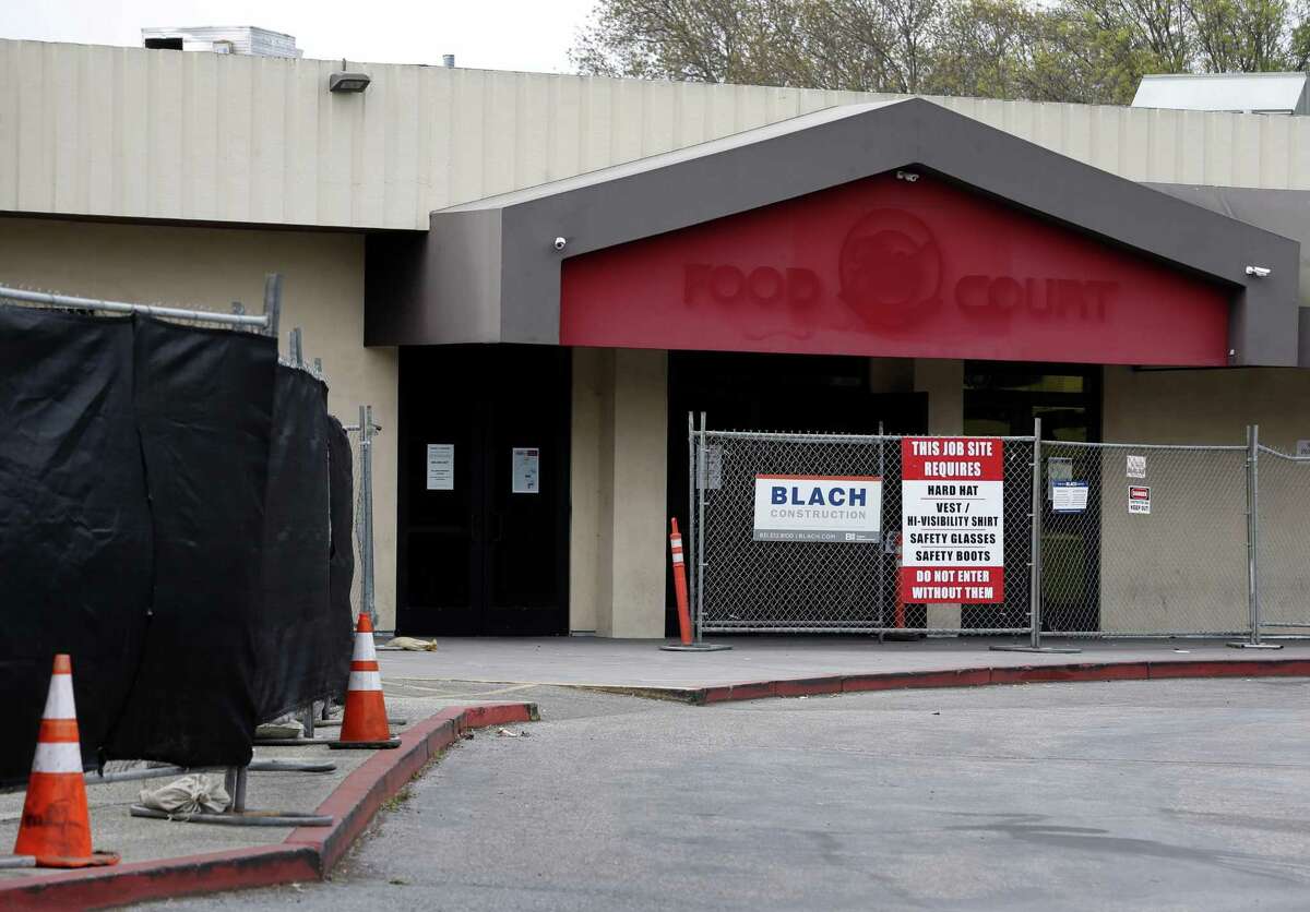 An entrance to the Food Court of the Vallco shopping mall is fenced off in Cupertino, Calif. on Wednesday, Feb. 14, 2018. Few tenants remain at the mall in the western Santa Clara Valley, including an AMC Theater and a couple of restaurants, but it is largely abandoned.