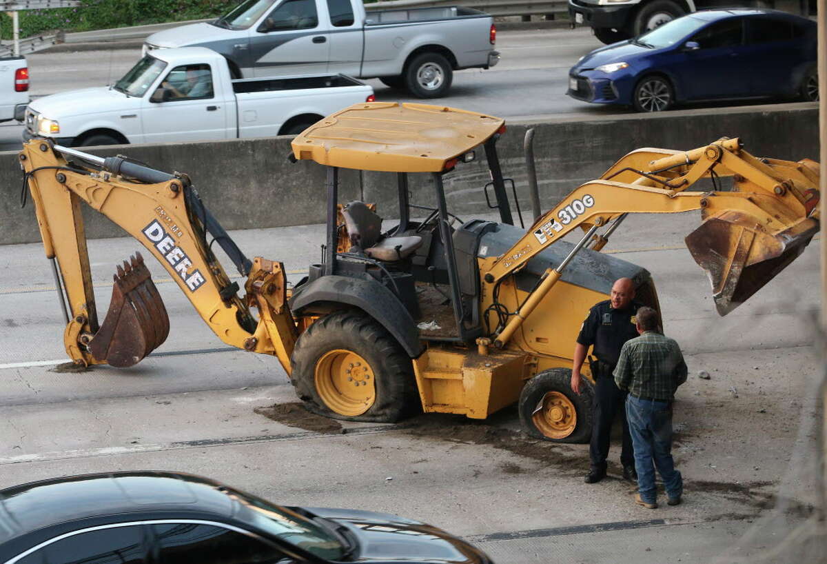 A lost load of construction equipment on Interstate Highway 10 westbound at Waco Street has blocked three main lanes and delayed the morning traffic on Thursday, Sept. 20, 2018, in Houston. It appears that the situation happened when the vehicle carrying the construction equipment struck the Waco Street bridge.
